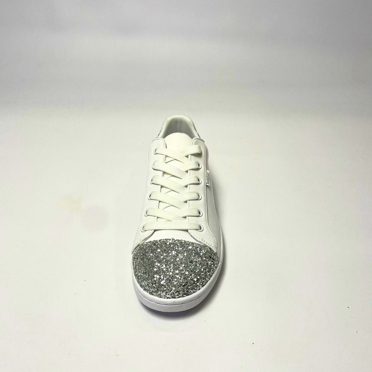 Holster Stardust White Sneaker – Vegan-friendly, PETA-approved sneaker featuring a glitter toe and heel cap. Designed with a soft padded PU upper, cushioned PU foam insole, and non-slip rubber outsole for comfort and durability. Lightweight, antibacterial, and flexible. Adjustable polyester shoelaces for a secure fit. 4