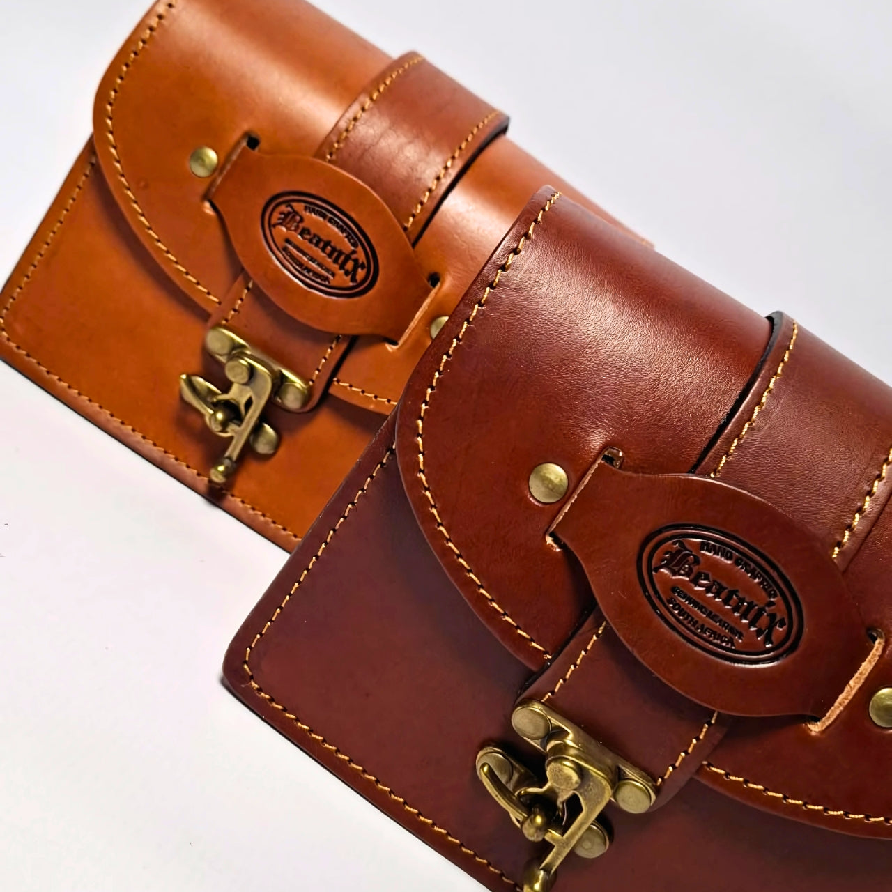 Beatnix Carmen Tan Leather Shoulder Bag – A stylish and compact handbag crafted from 100% full-grain vegetable-tanned leather. Features a single roomy compartment, secure front clasp closure, and an adjustable, removable shoulder strap for versatile wear. Designed with high-quality stitching, durable hardware, and a molded handle. Dimensions: 17cm (broad) x 8cm (high) x 12cm (deep). Perfect for young ladies transitioning to carrying essentials beyond a phone. 3