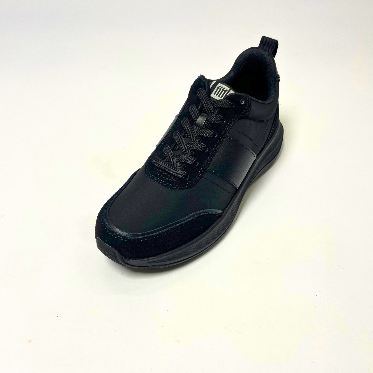 FitFlop F-Mode Flow Fabric Flatform black sneaker with cushioned Microwobbleboard midsole, arch support & recycled PET fabric upper. 2
