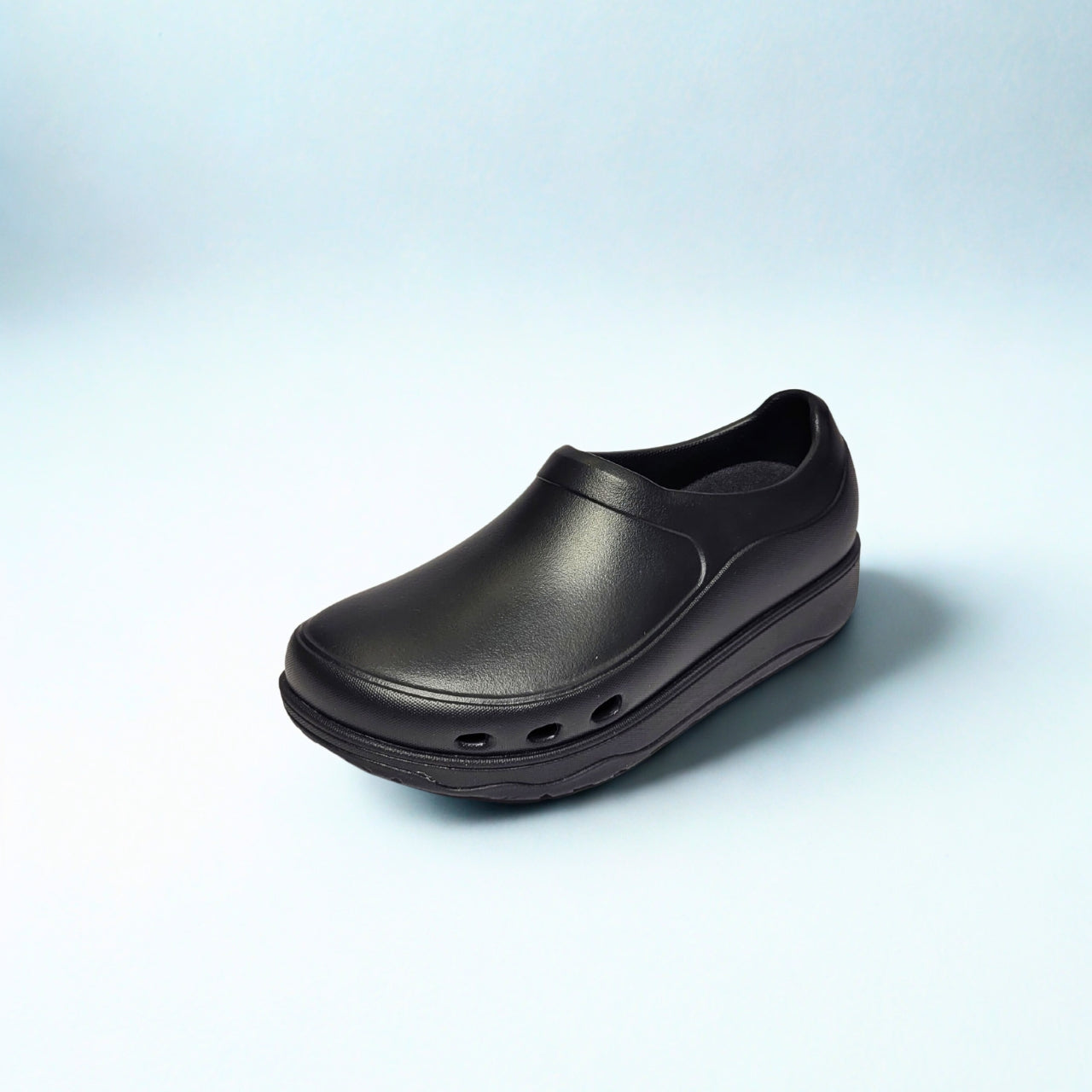 FitFlop black EVA clogs with slip-resistant sole and wide-fit Microwobbleboard cushioning. 2
