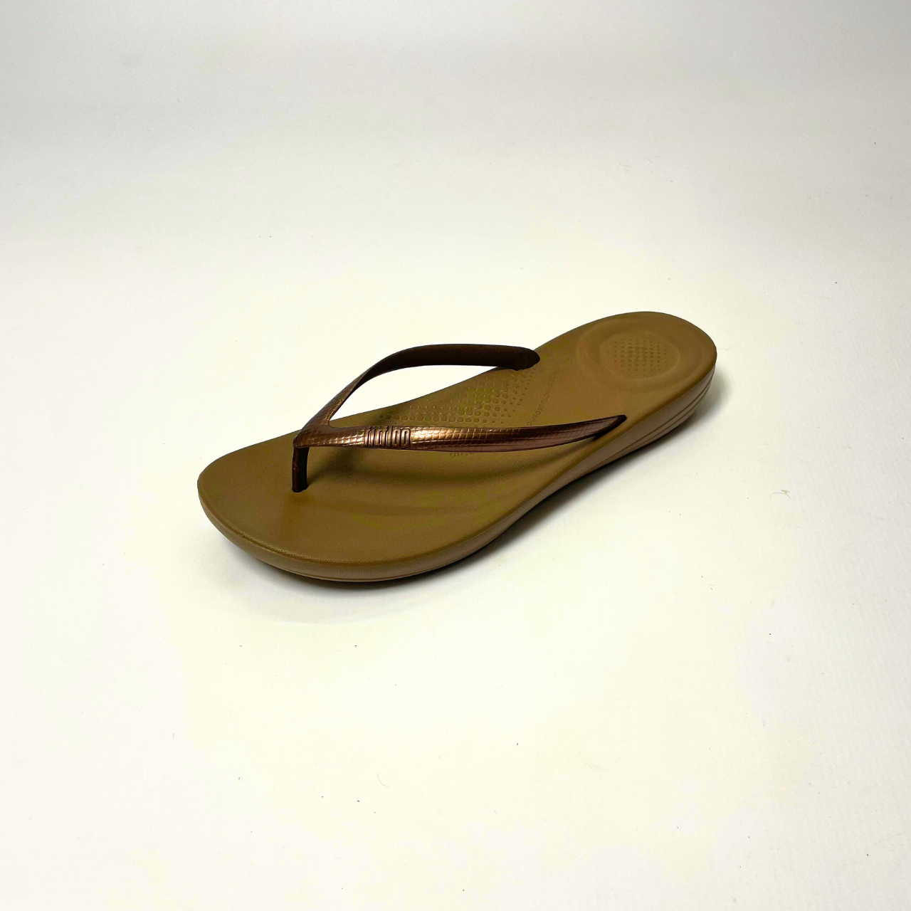FitFlop iQushion bronze ergonomic flip-flops with soft jelly upper, micro-bubble foam footbed, seamless arch support & slip-resistant soles. 2