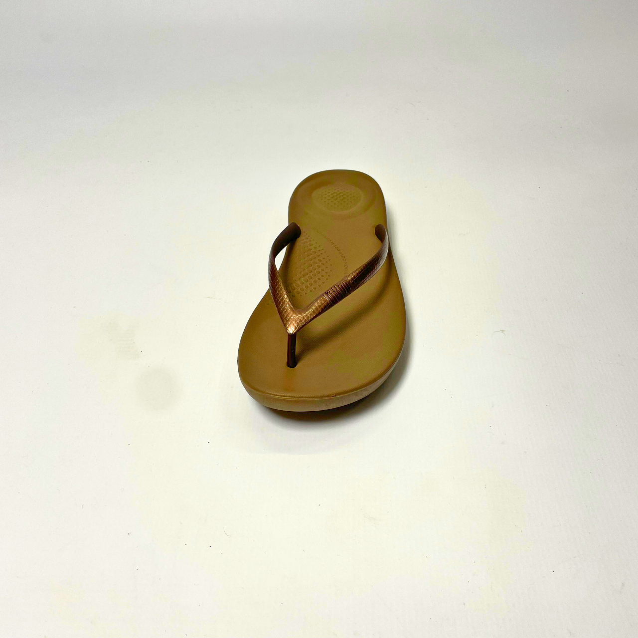 FitFlop iQushion bronze ergonomic flip-flops with soft jelly upper, micro-bubble foam footbed, seamless arch support & slip-resistant soles. 4