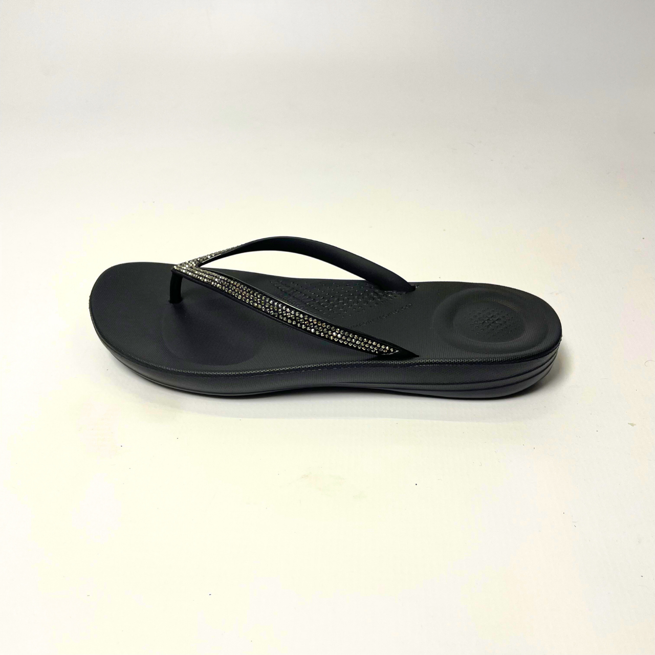FitFlop iQushion Glitter black ergonomic flip-flops with soft jelly upper, micro-bubble foam footbed, seamless arch support & slip-resistant soles. 3