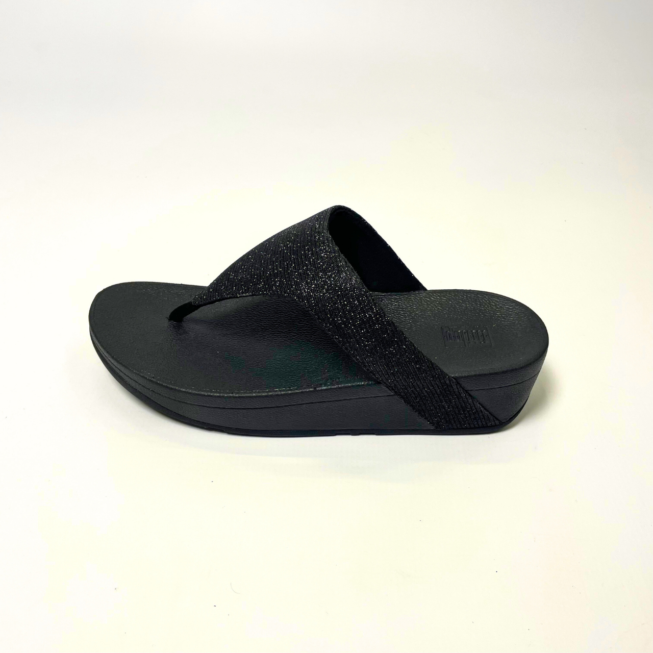 Fitflop LOTTIE GLITZY black sandal with shimmering textile upper, cushioned Microwobbleboard midsole & slip-resistant rubber outsole. 3