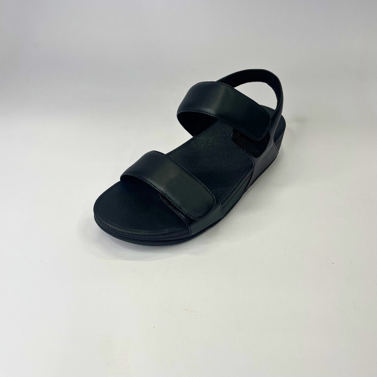 FitFlop Lulu Adjustable Leather Back-Strap black sandal with cushioned Microwobbleboard midsole, microfibre lining & slip-resistant outsole. 2