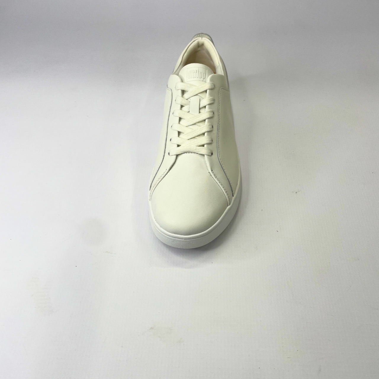 FitFlop Rally leather urban white sneaker with ultra-flexible cushioning, anatomically contoured footbed & slip-resistant rubber pods for maximum comfort. 4