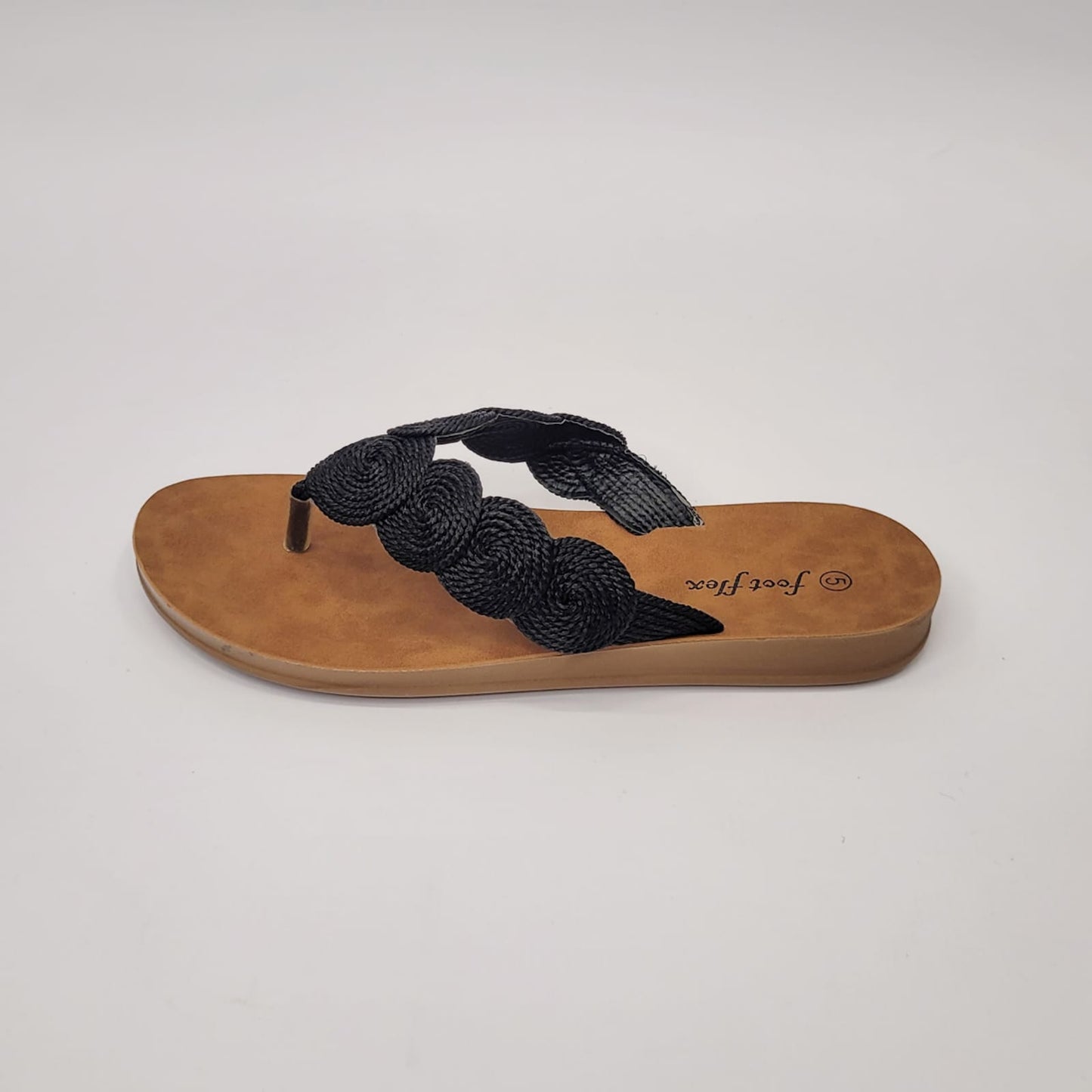 Foot Flex black string toe thong sandal with woven detail, cushioned footbed, and lightweight flexible sole. 3