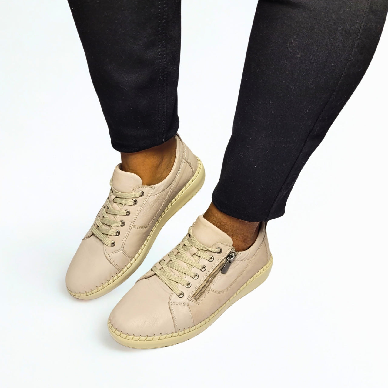 GIA silver leather sneaker with side zip, lace-up front, and cushioned insole. 1