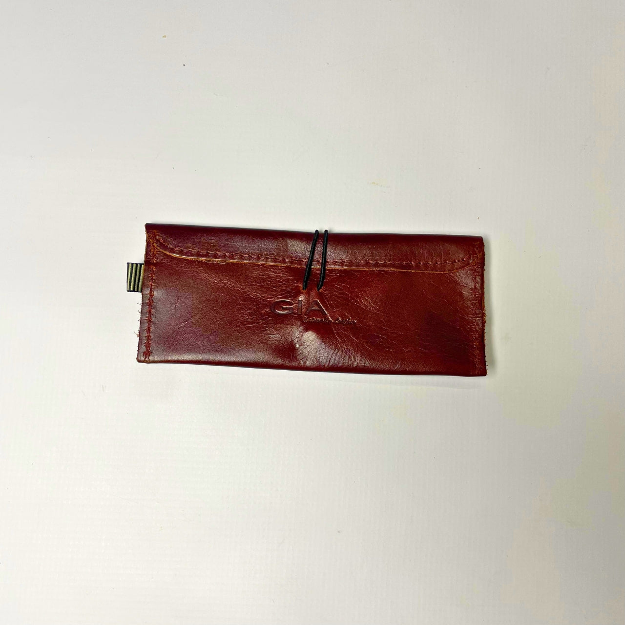 Gia Leather Maroon Sunglass Case, crafted from genuine leather. Sleek and protective design with a soft lining to prevent scratches. Fits most standard-sized sunglasses. Made in South Africa.