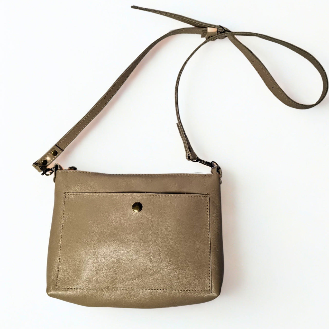 Gia taupe TED Cross Body Bag in genuine leather, featuring an adjustable strap, secure closure, and compact design for everyday essentials. Made in South Africa. 1