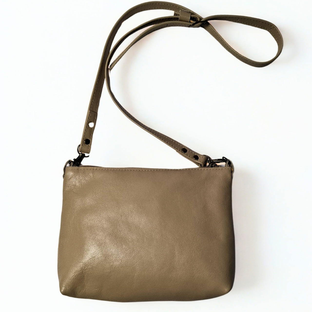 Gia taupe TED Cross Body Bag in genuine leather, featuring an adjustable strap, secure closure, and compact design for everyday essentials. Made in South Africa. 2