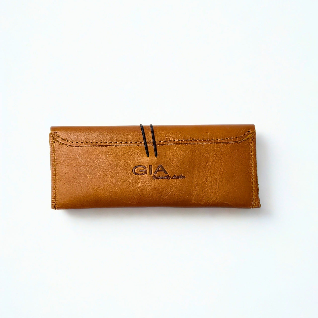 Gia toffee leather sunglass case with snap closure and soft lining for scratch protection. 1
