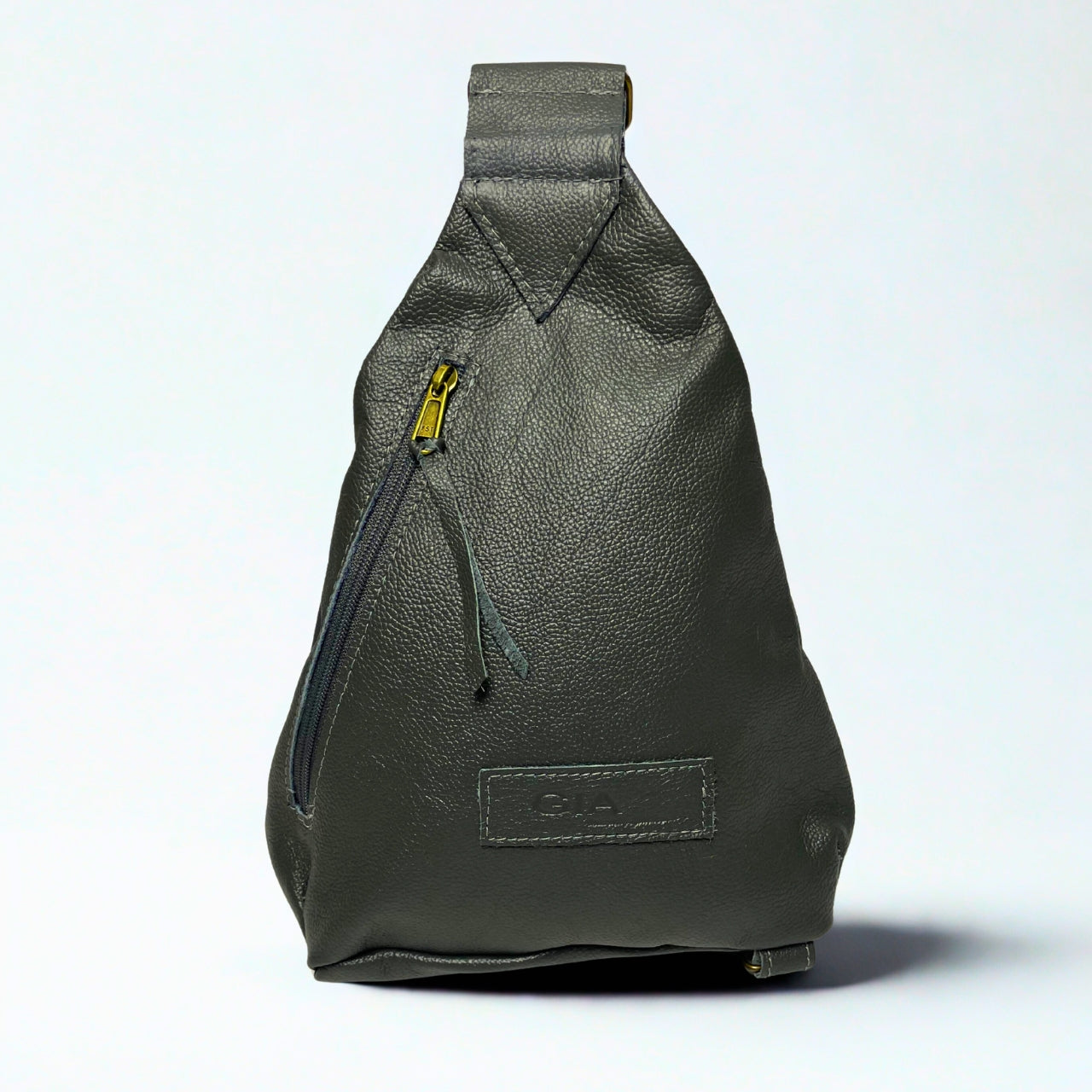 Gia grey triangle backpack in metallic leather with gold buckle, front and rear zip pockets.