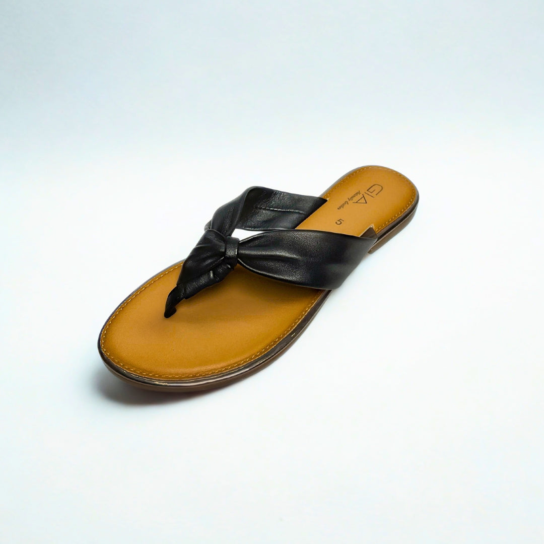 Gia black leather knot sandals with cushioned insole, slip-on design, and knotted strap detail – chic women’s summer footwear for casual wear, holidays, and resort style.