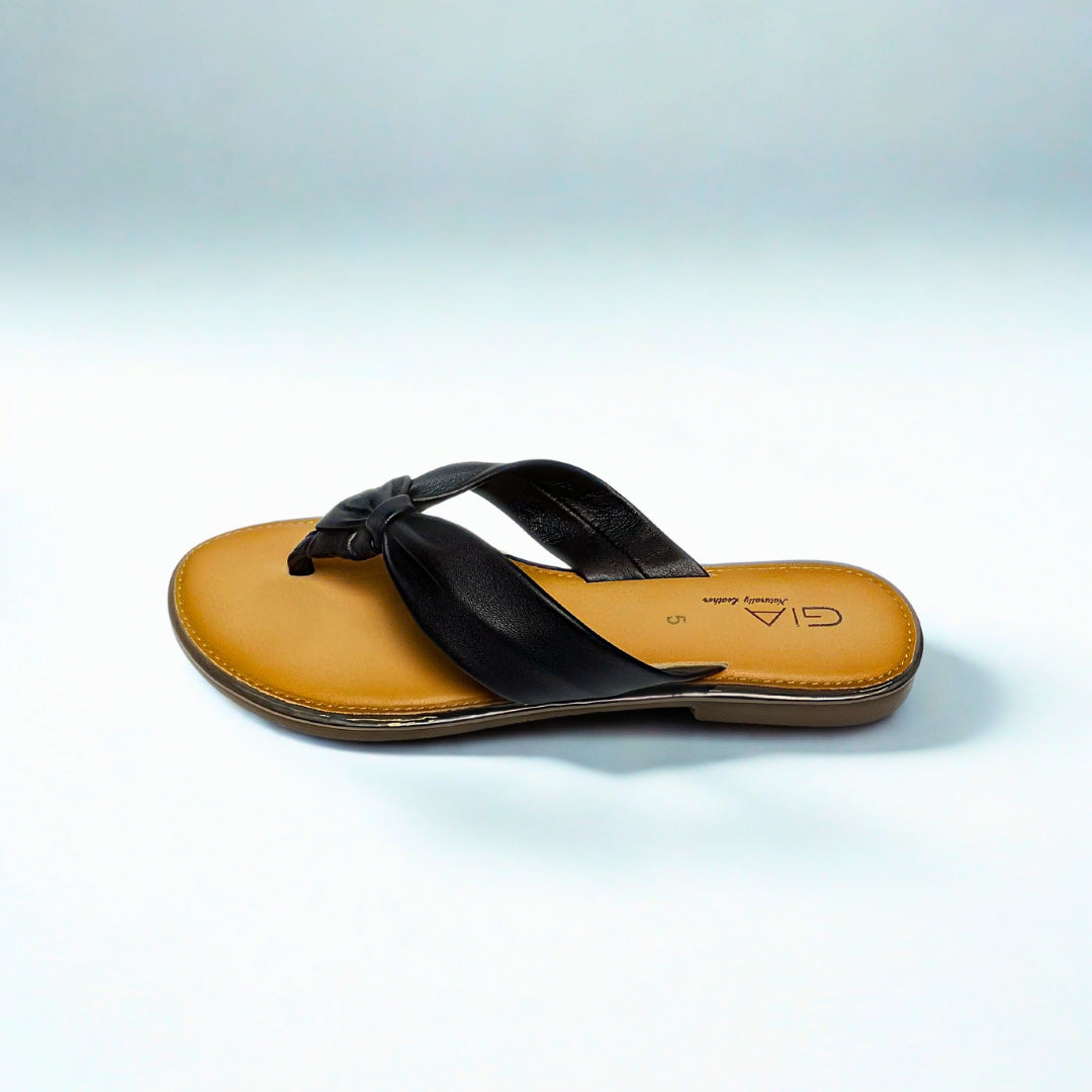 Gia black leather knot sandals with cushioned insole, slip-on design, and knotted strap detail – chic women’s summer footwear for casual wear, holidays, and resort style.