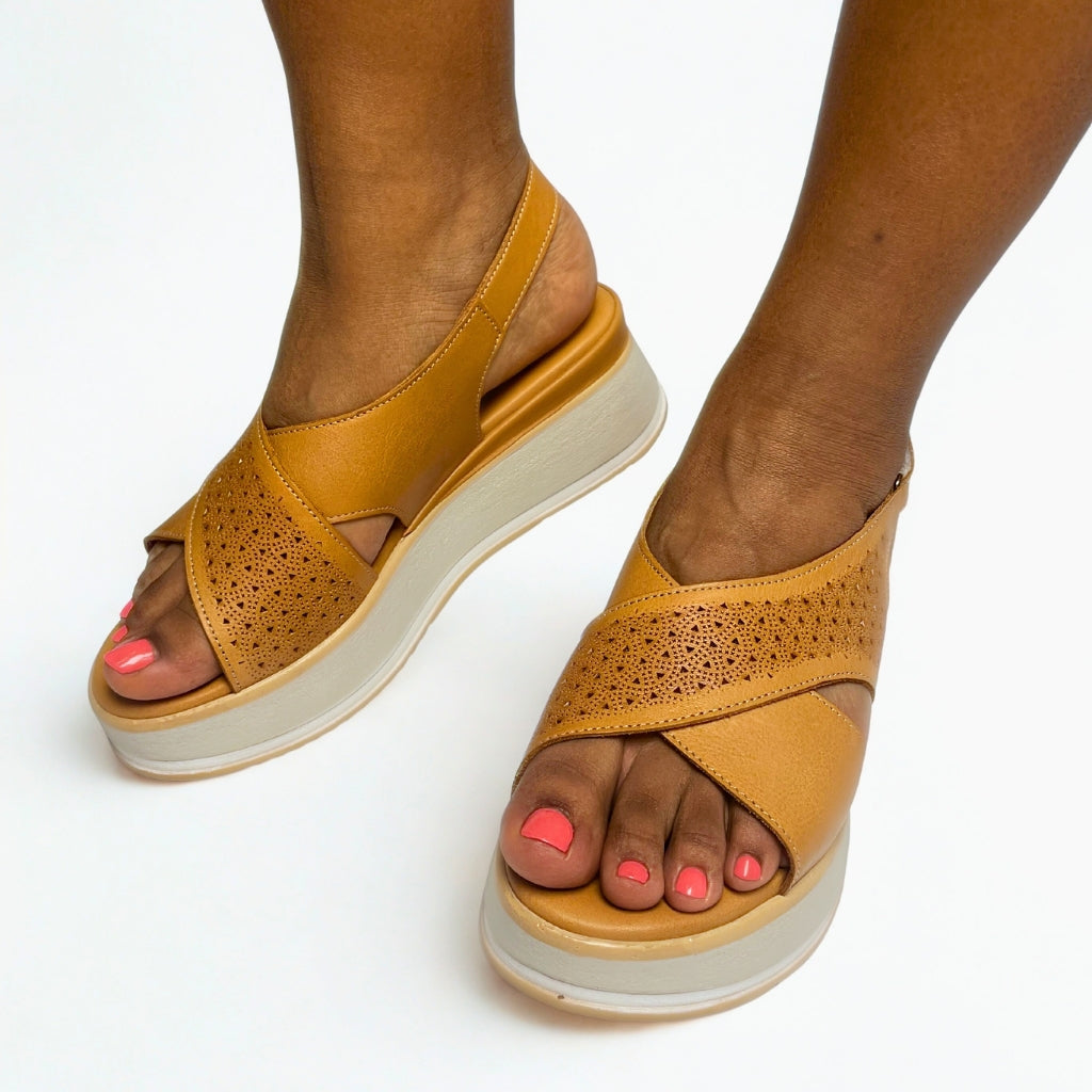 Gia coconut tan leather platform sandals with laser-cut cross-over straps, cushioned insole, slingback strap, and slip-resistant sole â trendy womenâs summer sandals with added height.