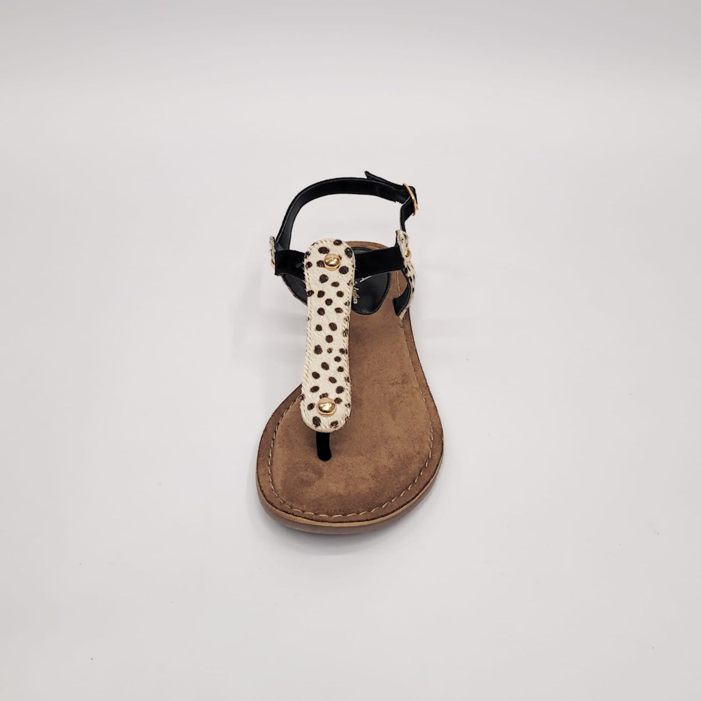 Gia leather sandal with black and dalmatian-patterned toe thong strap, adjustable strap, crafted in India, perfect for stylish and comfortable summer wear. 4