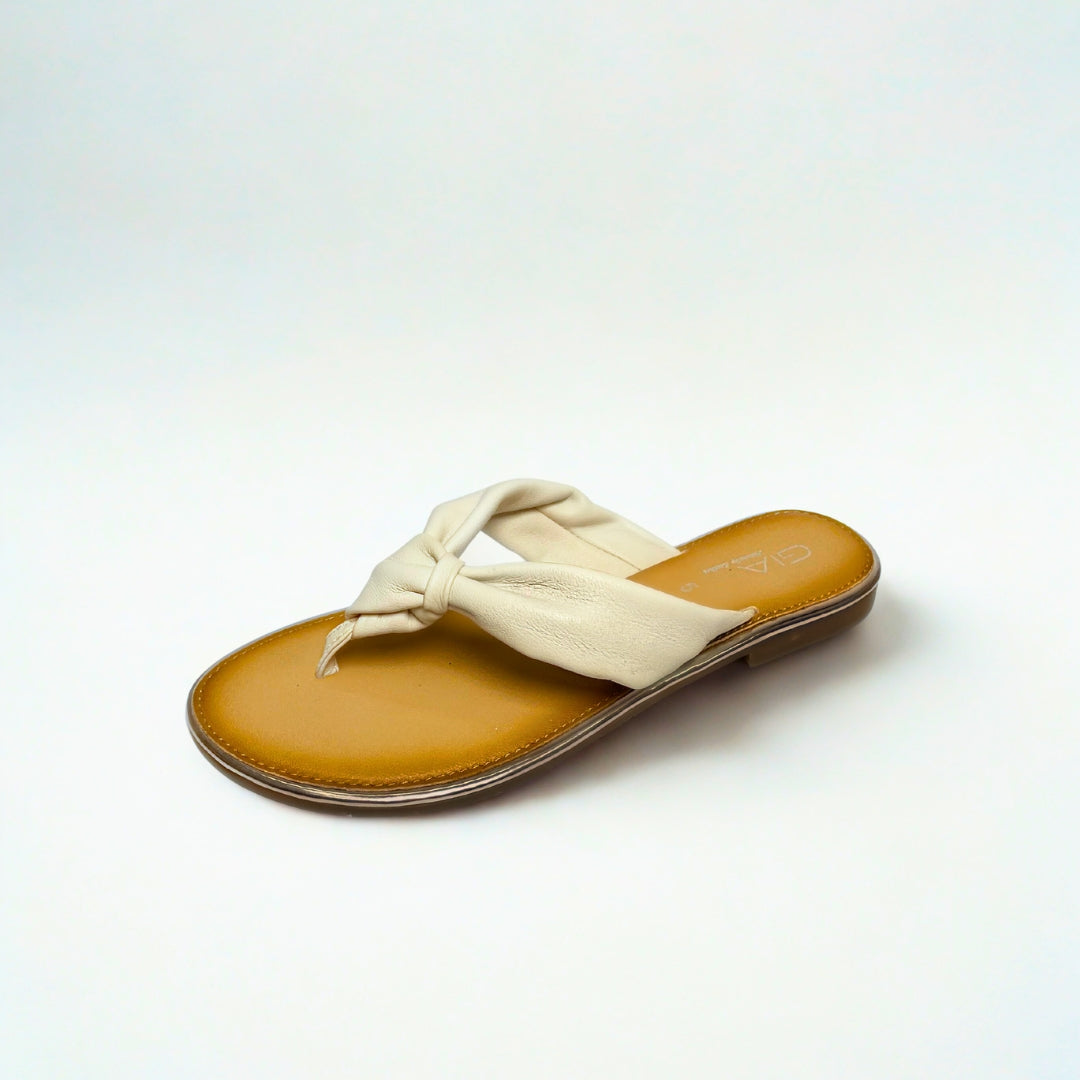 Gia white leather knot sandals with cushioned insole, slip-on design, and knotted strap detail – chic women’s summer footwear for casual wear, holidays, and resort style.