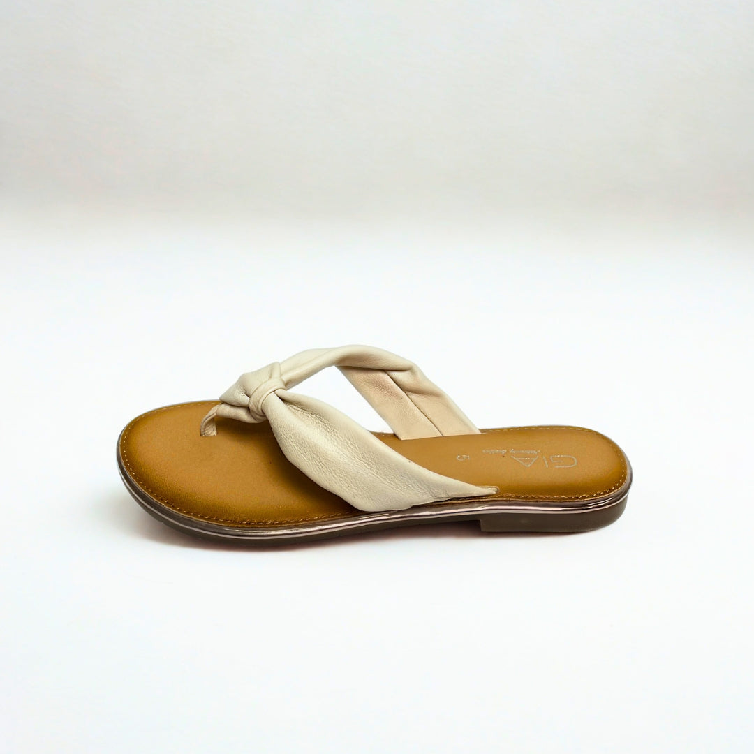 Gia white leather knot sandals with cushioned insole, slip-on design, and knotted strap detail – chic women’s summer footwear for casual wear, holidays, and resort style.