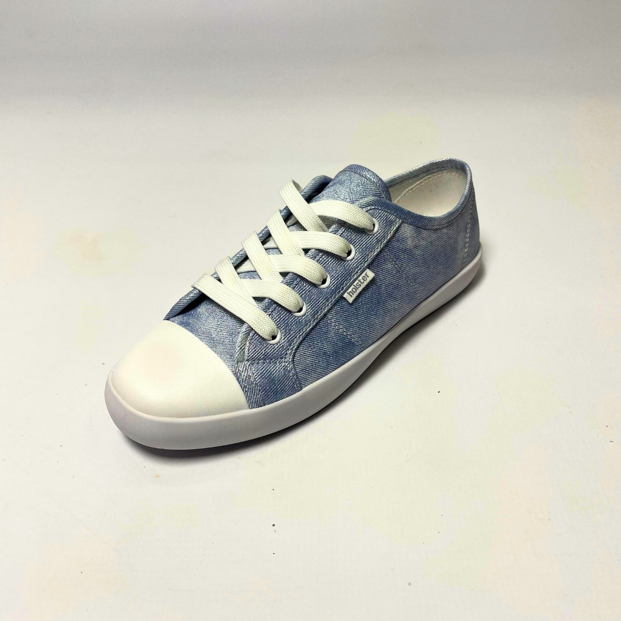 Holster Cleo Light Denim Shimmer Sneaker – Vegan-friendly, cruelty-free lace-up sneaker with a fabric shimmer PU upper and white PU toe cap. Features soft cotton lining, padded PU foam insole, and non-slip rubber outsole. Designed with antibacterial and anti-mould properties for lasting freshness. 2