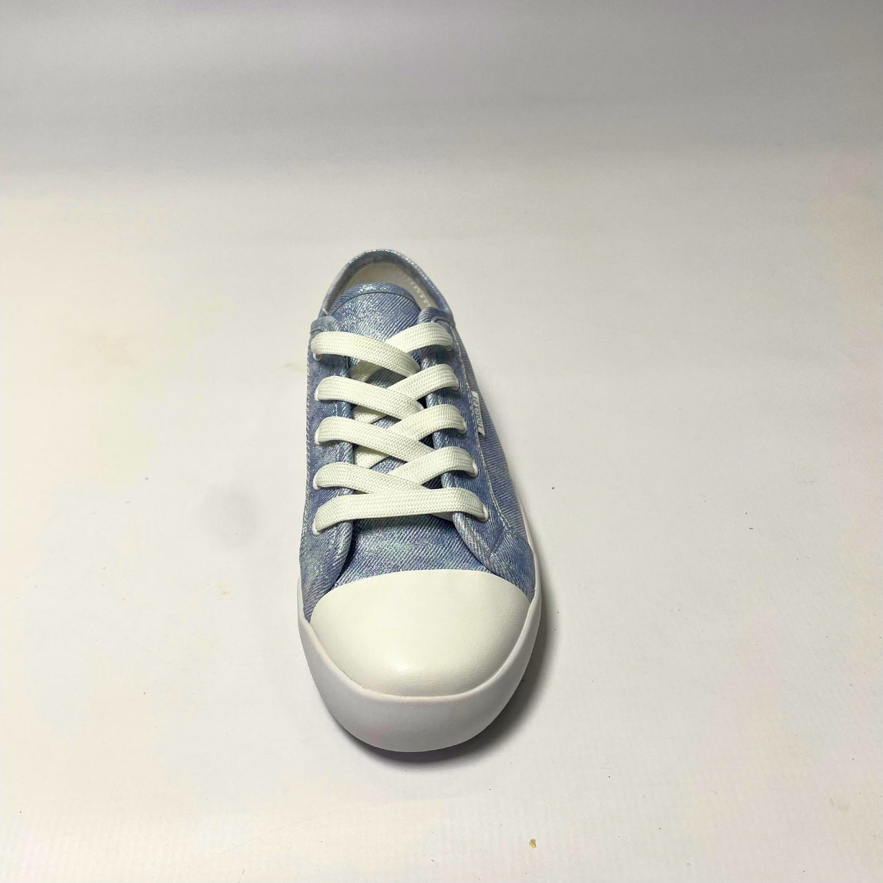 Holster Cleo Light Denim Shimmer Sneaker – Vegan-friendly, cruelty-free lace-up sneaker with a fabric shimmer PU upper and white PU toe cap. Features soft cotton lining, padded PU foam insole, and non-slip rubber outsole. Designed with antibacterial and anti-mould properties for lasting freshness. 4