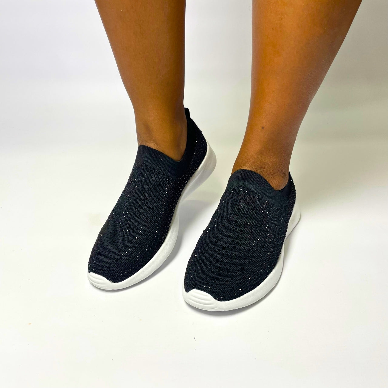 Holster Fireflyer Black Sneaker β Vegan-friendly, cruelty-free slip-on sneaker with 3,100 hot-fixed jewels per pair. Made from recycled ocean plastics, certified by the Global Recycled Standard. Features a lightweight EVA foam outsole, soft padded PU foam insoles, and podiatry-approved comfort. Anti-mould, antibacterial, and non-slip for all-day wear. 1