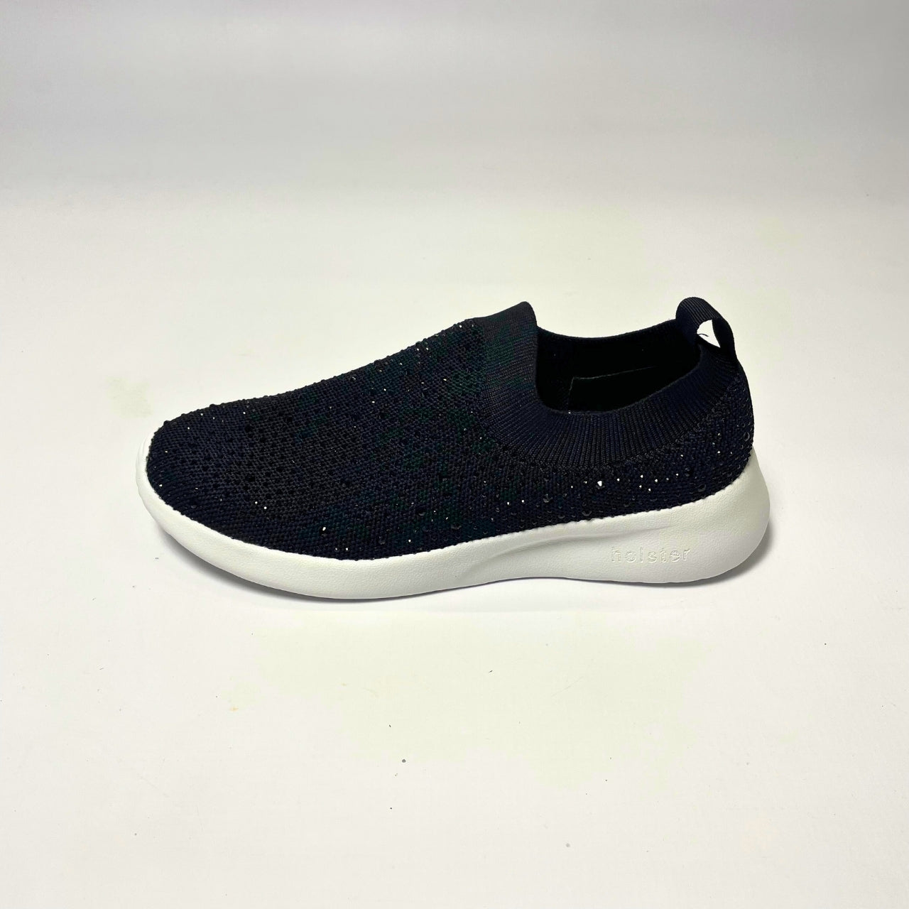 Holster Fireflyer Black Sneaker β Vegan-friendly, cruelty-free slip-on sneaker with 3,100 hot-fixed jewels per pair. Made from recycled ocean plastics, certified by the Global Recycled Standard. Features a lightweight EVA foam outsole, soft padded PU foam insoles, and podiatry-approved comfort. Anti-mould, antibacterial, and non-slip for all-day wear. 3