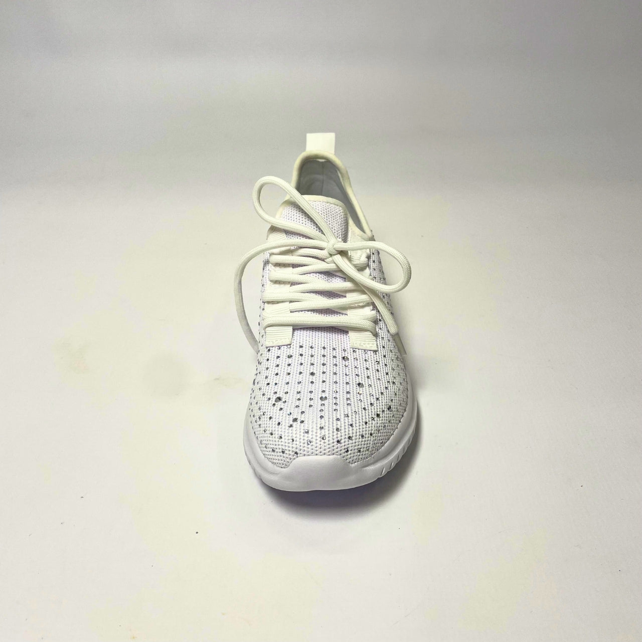 Holster Lumina White Sneaker – Vegan-friendly, cruelty-free slip-on sneaker with 3,100 hot-fixed jewels per pair. Made from recycled ocean plastics, certified by the Global Recycled Standard. Features a lightweight EVA foam outsole, soft padded PU foam insoles, and podiatry-approved comfort. Anti-mould, antibacterial, and non-slip for all-day wear. 4