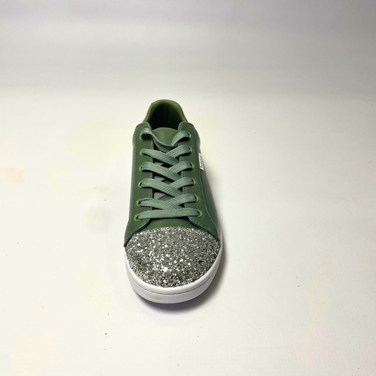Holster Stardust Green Sneaker – Vegan-friendly, PETA-approved sneaker featuring a glitter toe and heel cap. Designed with a soft padded PU upper, cushioned PU foam insole, and non-slip rubber outsole for comfort and durability. Lightweight, antibacterial, and flexible. Adjustable polyester shoelaces for a secure fit. 4