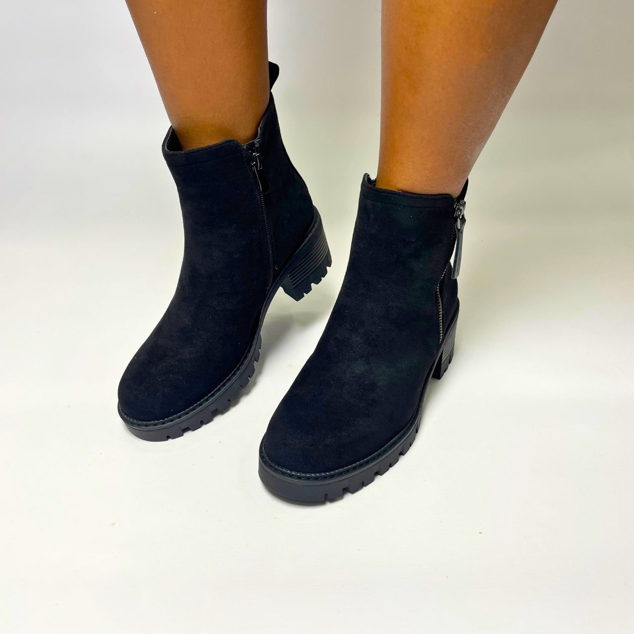 Jumbo Black Block Heel Ankle Boot – Soft suede upper in taupe, featuring a stacked block heel for height and stability. Rounded toe for a timeless look and inner side zipper for easy wear. Perfect for casual outings, chic fall style, and versatile wardrobe pairings. 1
