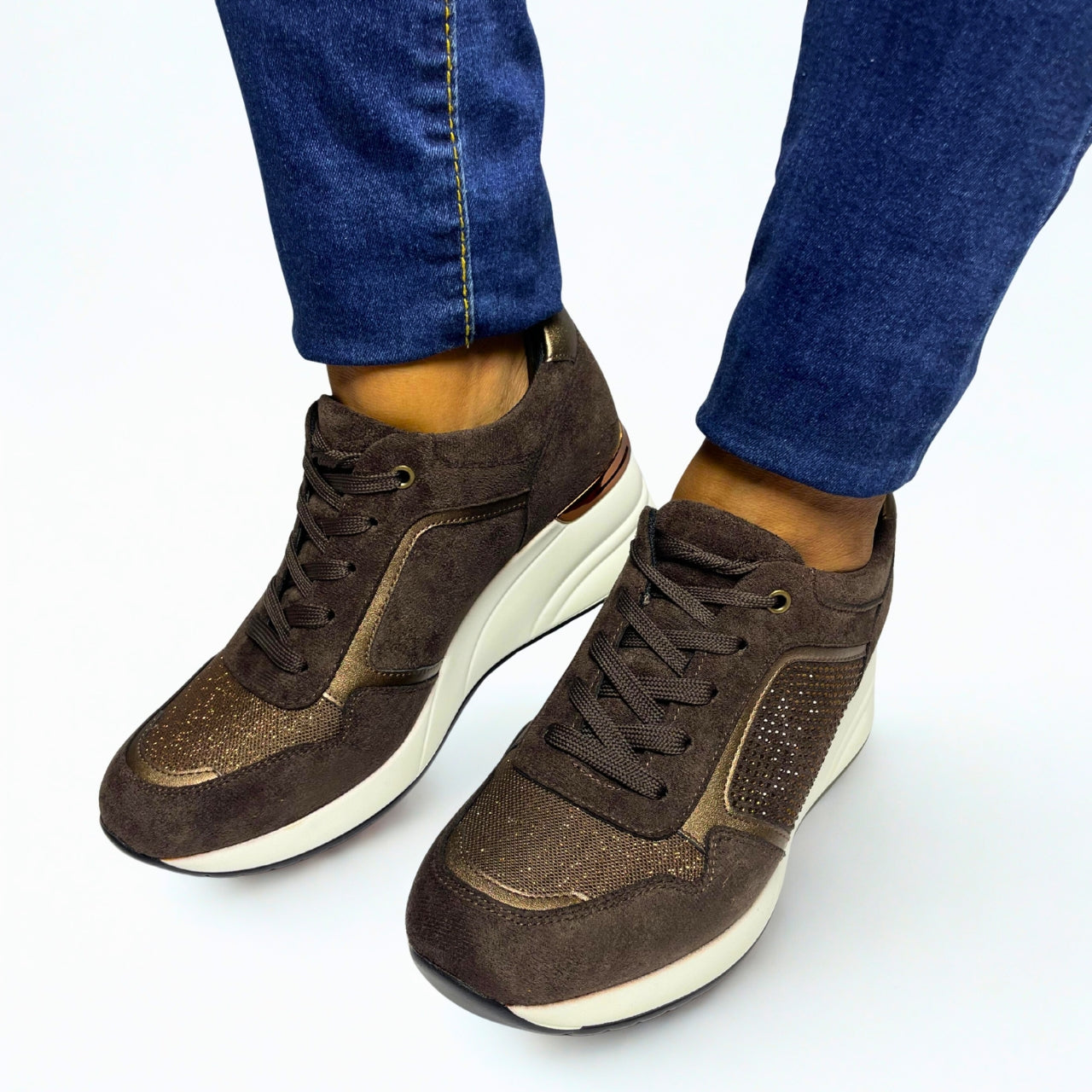 Jumbo brown lace-up wedge sneaker with diamante and bronze accents, hidden heel and white sole.