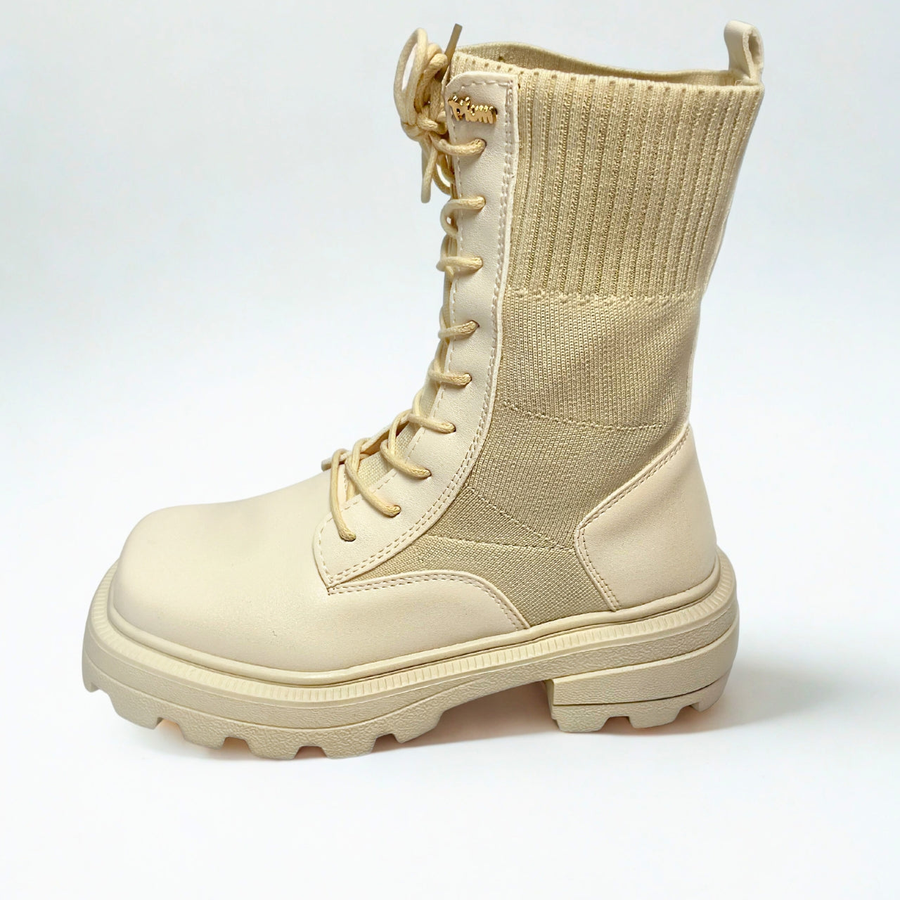 Plum beige combat-style boot with ribbed knit shaft, chunky lug sole, and lace-up front.