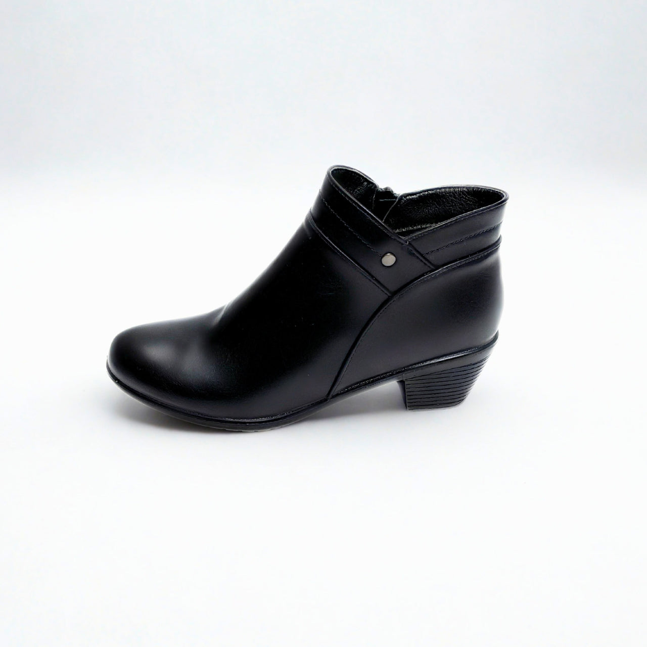 Black ankle boot with low block heel, tapered toe, side zip, and silver stud detail — perfect for smart-casual wear.
