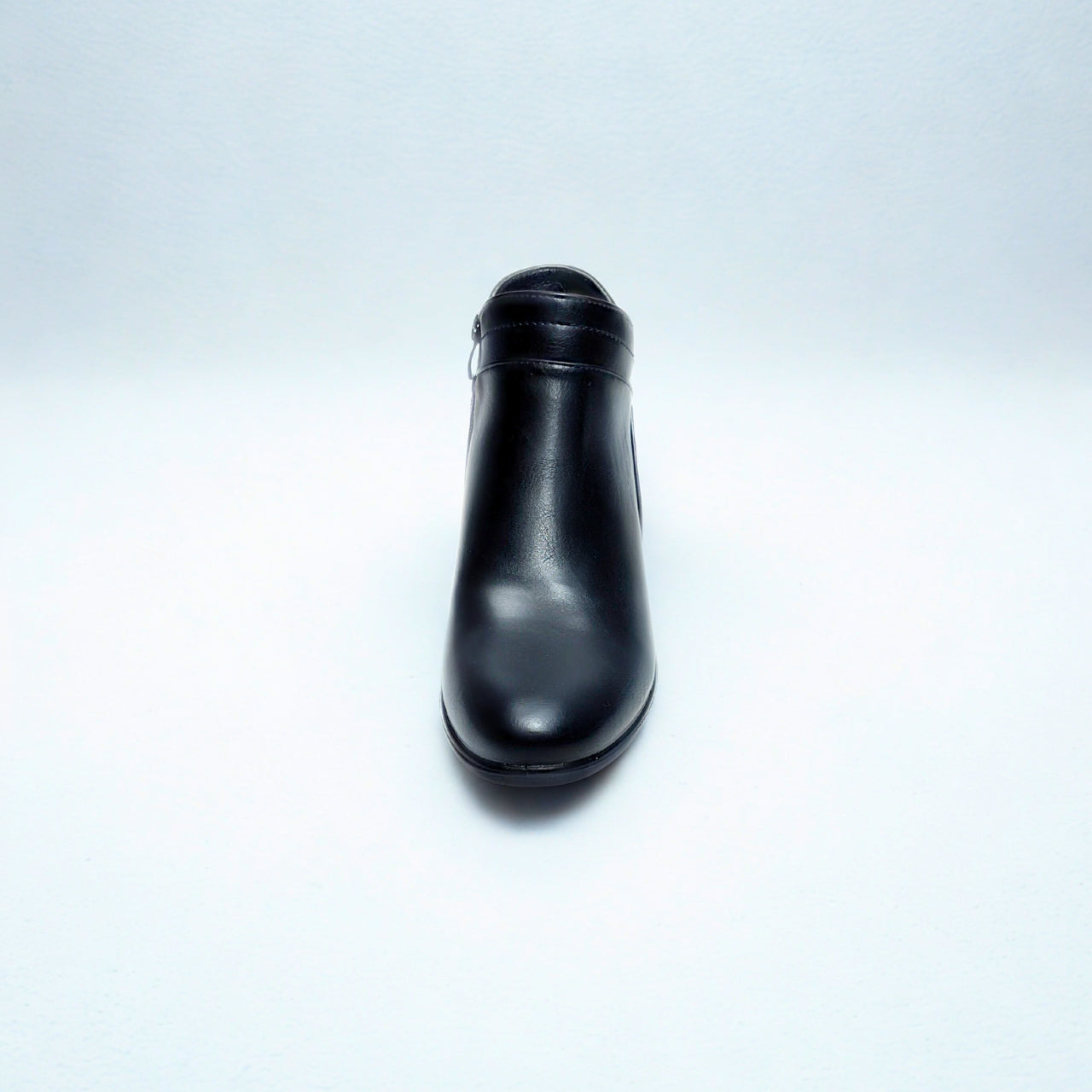 Black ankle boot with low block heel, tapered toe, side zip, and silver stud detail — perfect for smart-casual wear.