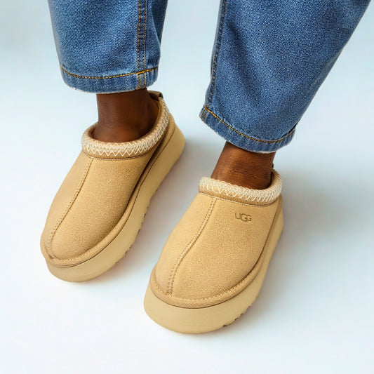 UGG Tazz Sand Clog – suede upper with 10mm UGGplush™ lining, eco-friendly UGGbraid trim, 1.75" platform sole, and embossed UGG® logo 1