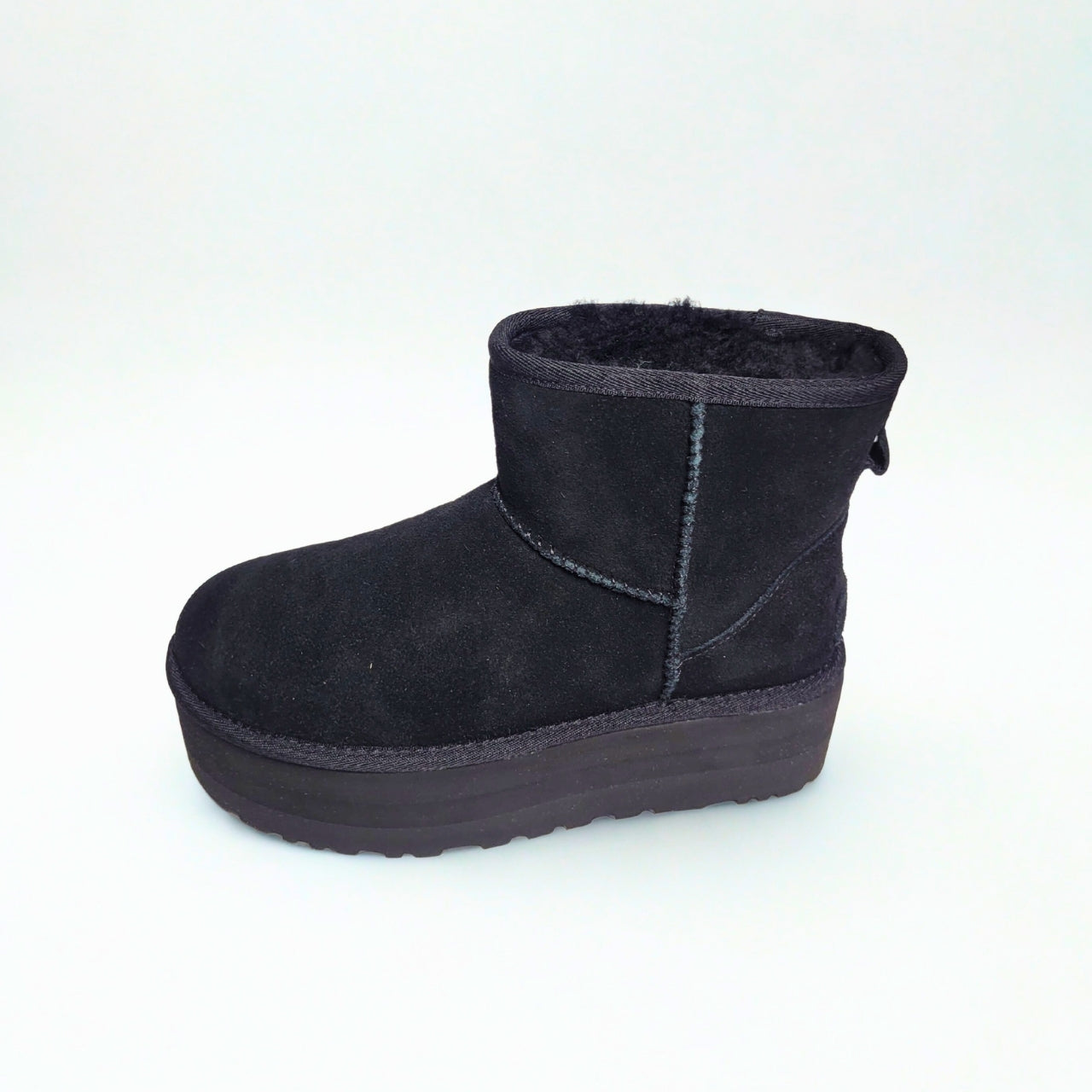 UGG Classic Mini black platform boot in suede with plush wool lining and 2" sole.
3
