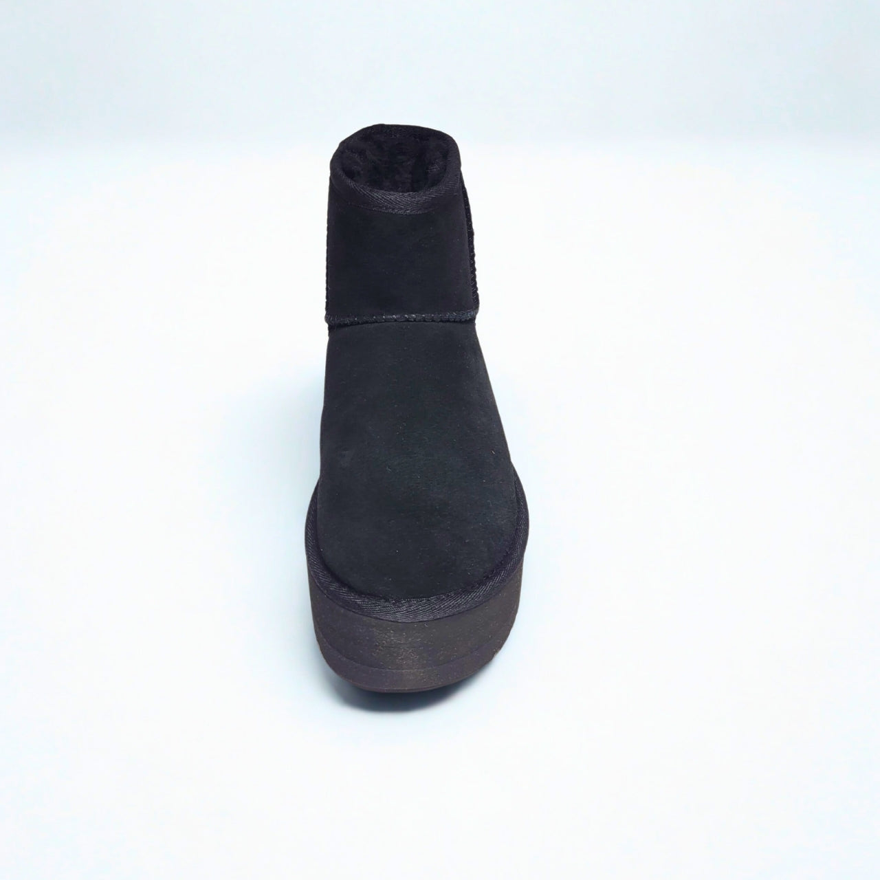 UGG Classic Mini black platform boot in suede with plush wool lining and 2" sole.
4
