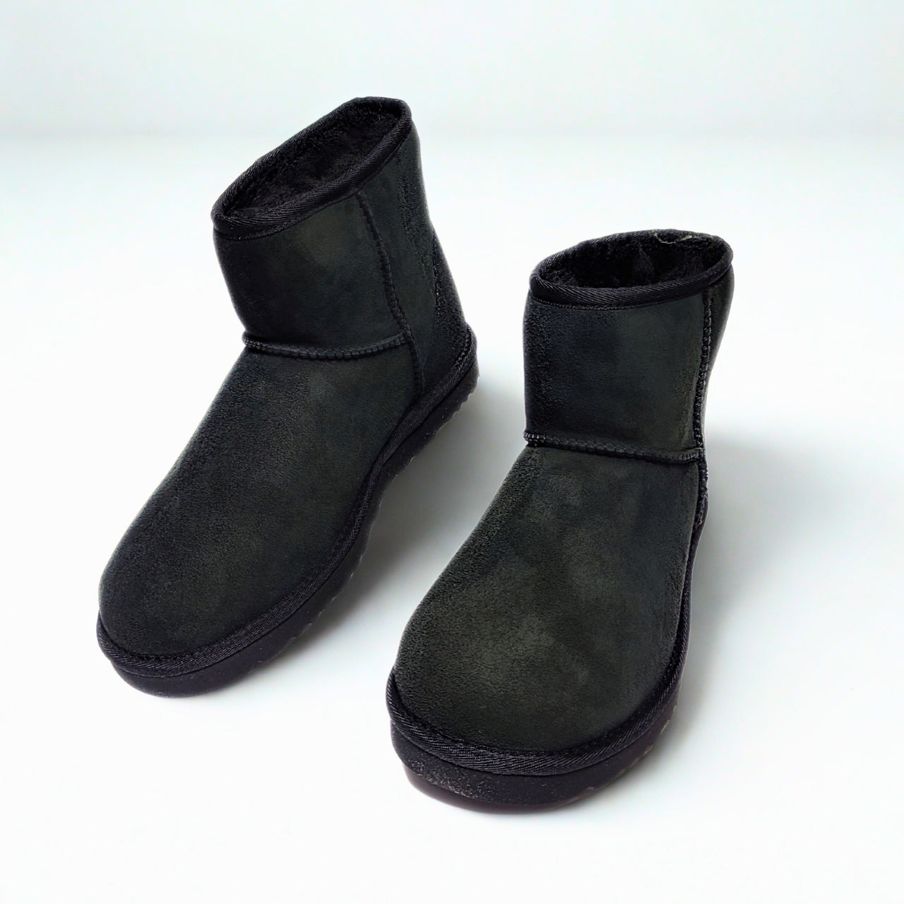 UGG men's Classic Mini black boot with twinface sheepskin and Treadlite outsole. 1