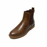 Butterfly Celeste 4 Chocolate Ankle Boot, a stylish faux leather slip-on boot with a round toe, elastic gusset, and contrast back heel detail. Features a comfort sock for all-day wear and a 2.5 cm heel. Perfect for casual and chic styling. 2