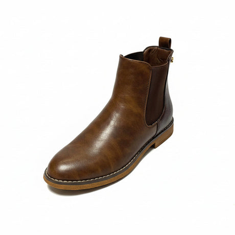 Butterfly Celeste 4 Chocolate Ankle Boot, a stylish faux leather slip-on boot with a round toe, elastic gusset, and contrast back heel detail. Features a comfort sock for all-day wear and a 2.5 cm heel. Perfect for casual and chic styling. 2