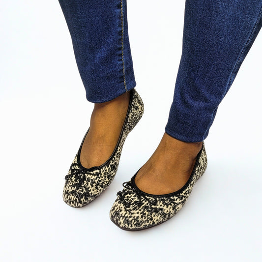 FitFlop Delicato black and ivory woven flats with nappa leather bow, slip-on design, and Dynamicush comfort technology 1