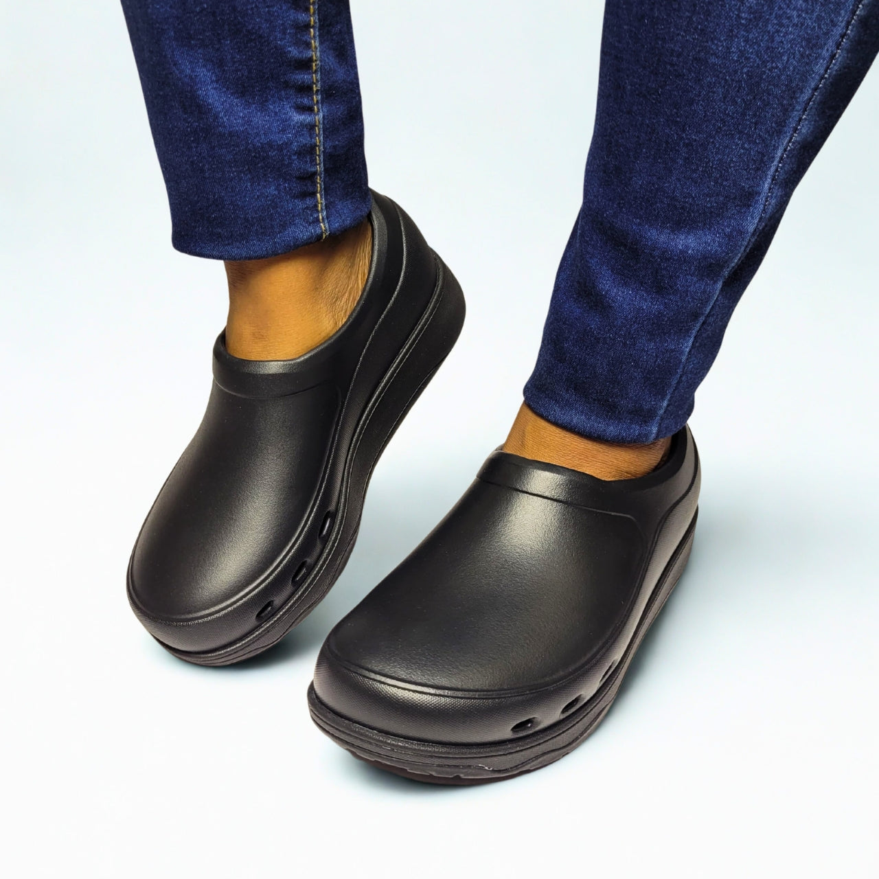  FitFlop black EVA clogs with slip-resistant sole and wide-fit Microwobbleboard cushioning. 1