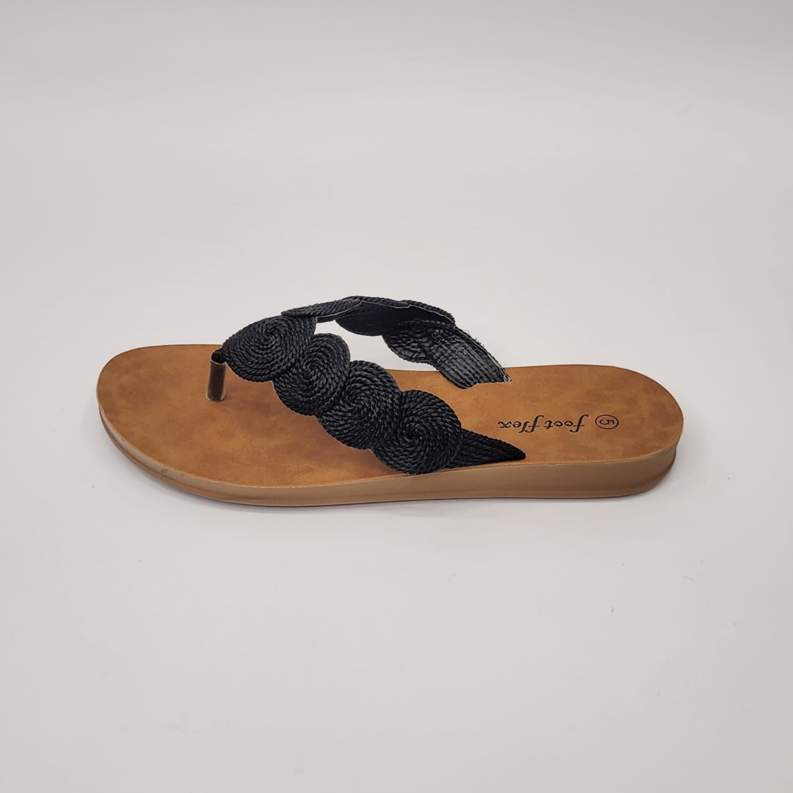 Foot Flex black string toe thong sandal with woven detail, cushioned footbed, and lightweight flexible sole. 3