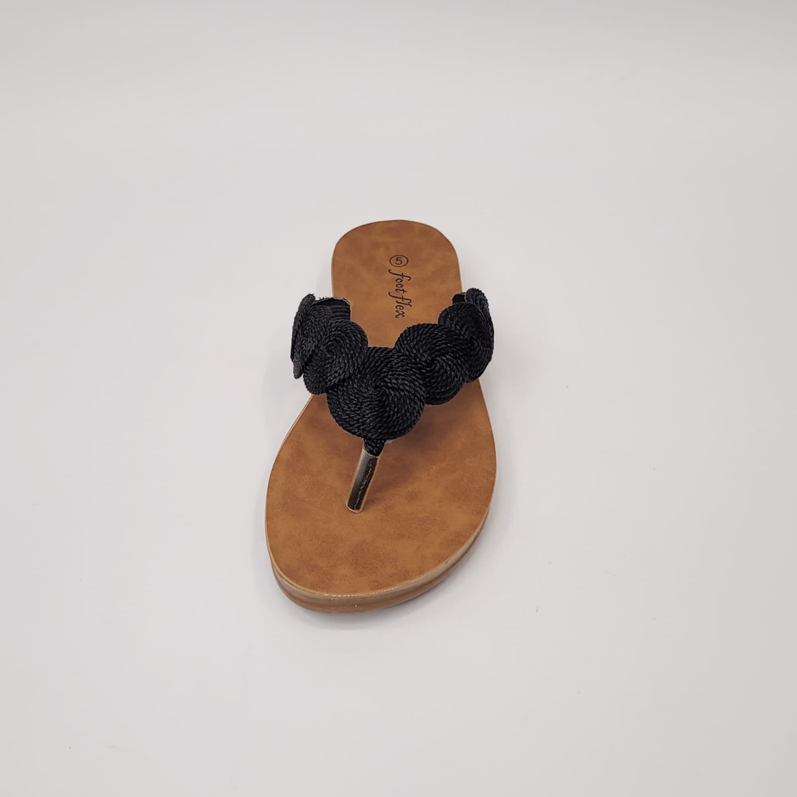 Foot Flex black string toe thong sandal with woven detail, cushioned footbed, and lightweight flexible sole. 4