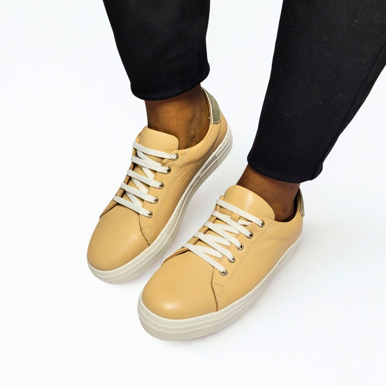  GIA beige leather platform sneaker with gold heel detail and lace-up design. 1