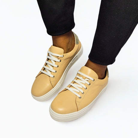 GIA beige leather platform sneaker with gold heel detail and lace-up design. 1