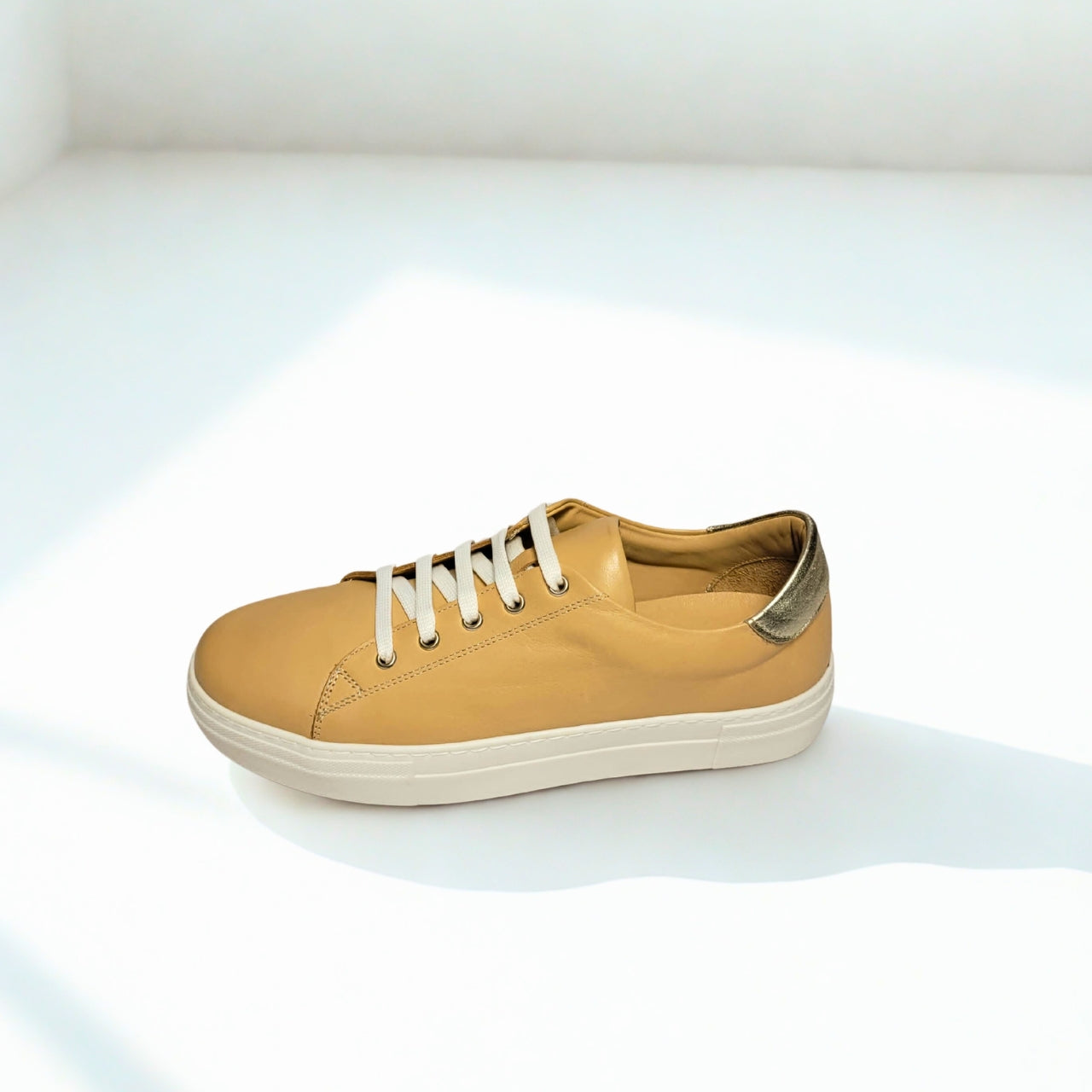  GIA beige leather platform sneaker with gold heel detail and lace-up design. 3