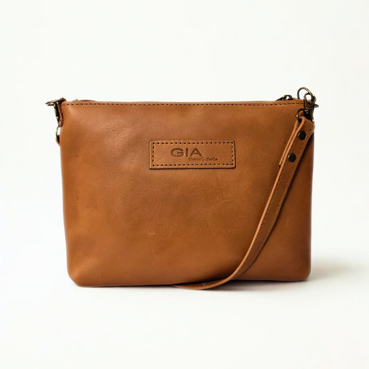 Gia Ted toffee leather crossbody bag with adjustable strap and compact design. 1