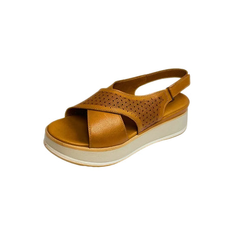 Gia coconut tan leather platform sandals with laser-cut cross-over straps, cushioned insole, slingback strap, and slip-resistant sole – trendy women’s summer sandals with added height.
