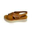 Gia coconut tan leather platform sandals with laser-cut cross-over straps, cushioned insole, slingback strap, and slip-resistant sole – trendy women’s summer sandals with added height.